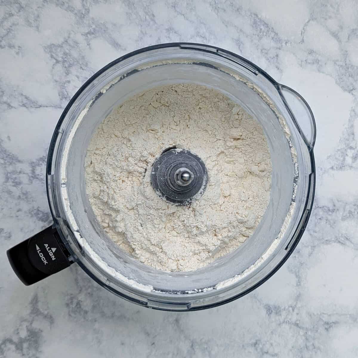 dry ingredients for pie crust, in a food processor