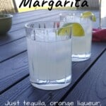 two margaritas on a patio table, with text overlay for Pinterest