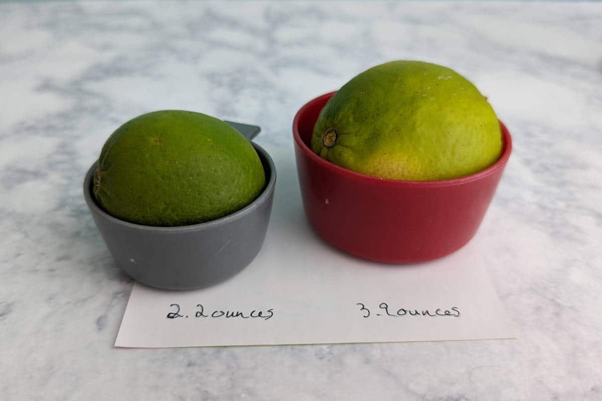 limes of different sizes in ¼ and ½ cup measuring cups