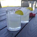 two margaritas on a table outside.