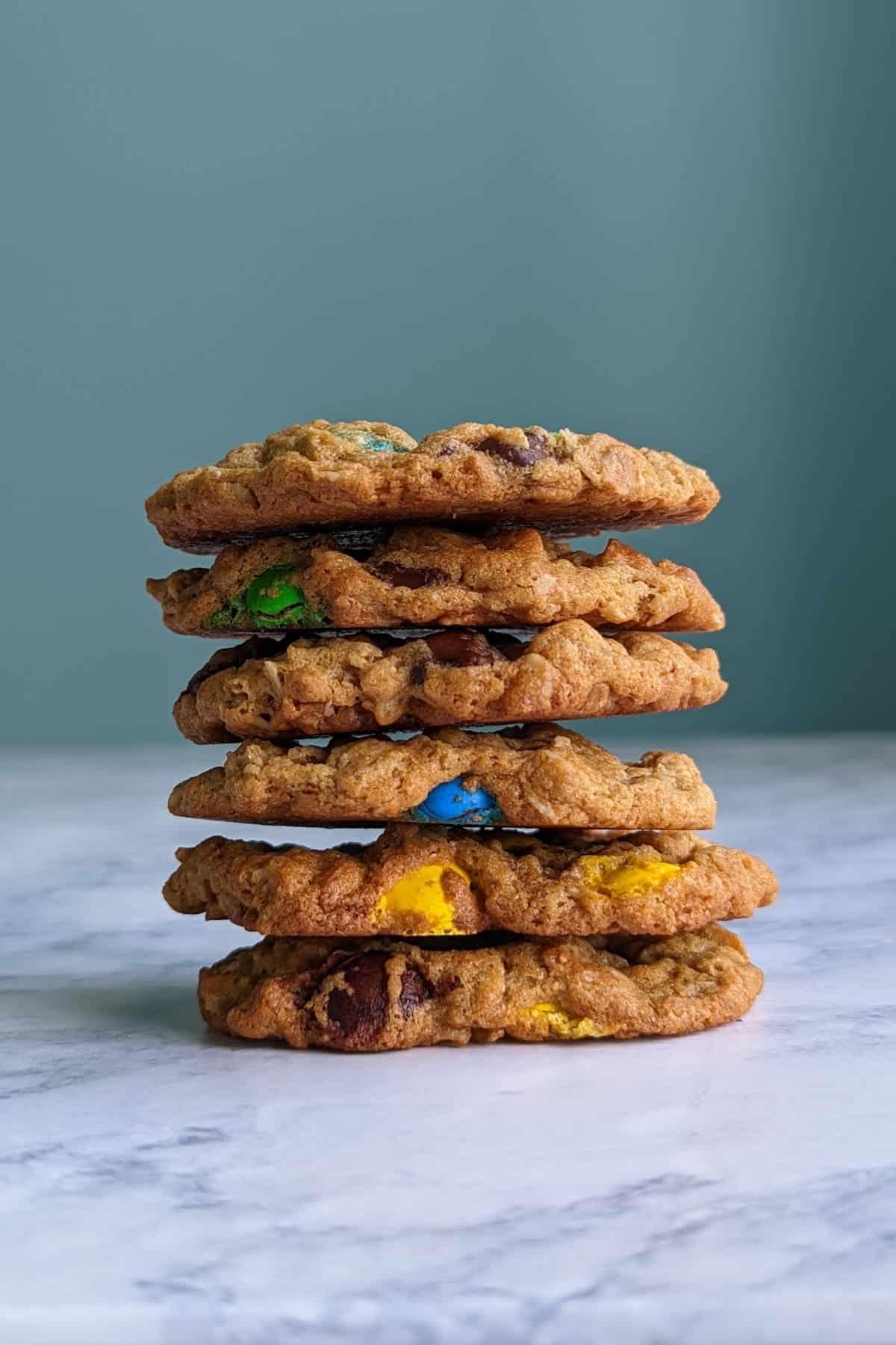 a tall stack of monster cookies