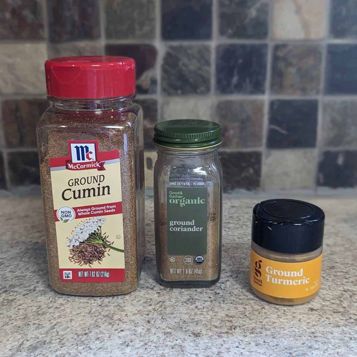 jars of cumin, coriander, and turmeric