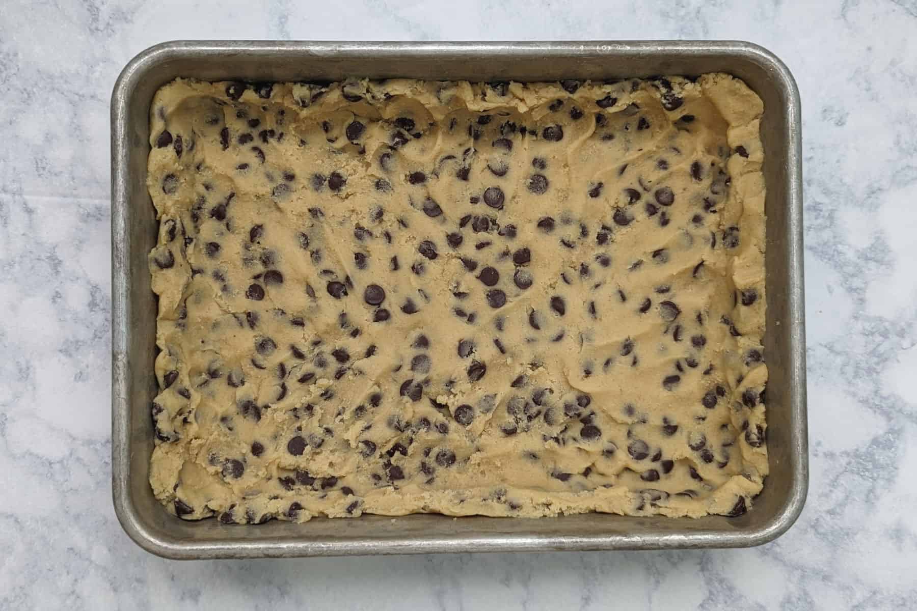 chocolate chip cookie dough, patted along the bottom and 1 inch up the sides of a 9x13 inch pan