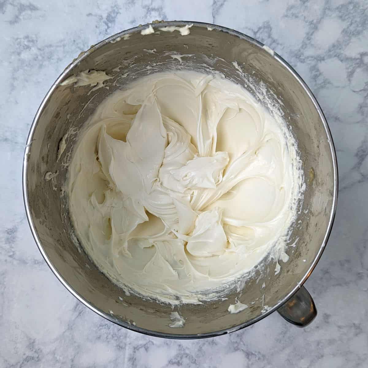 whipped cream cheese in a stand mixer bowl
