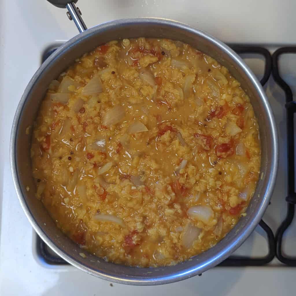 yellow dal, cooked, in a pot