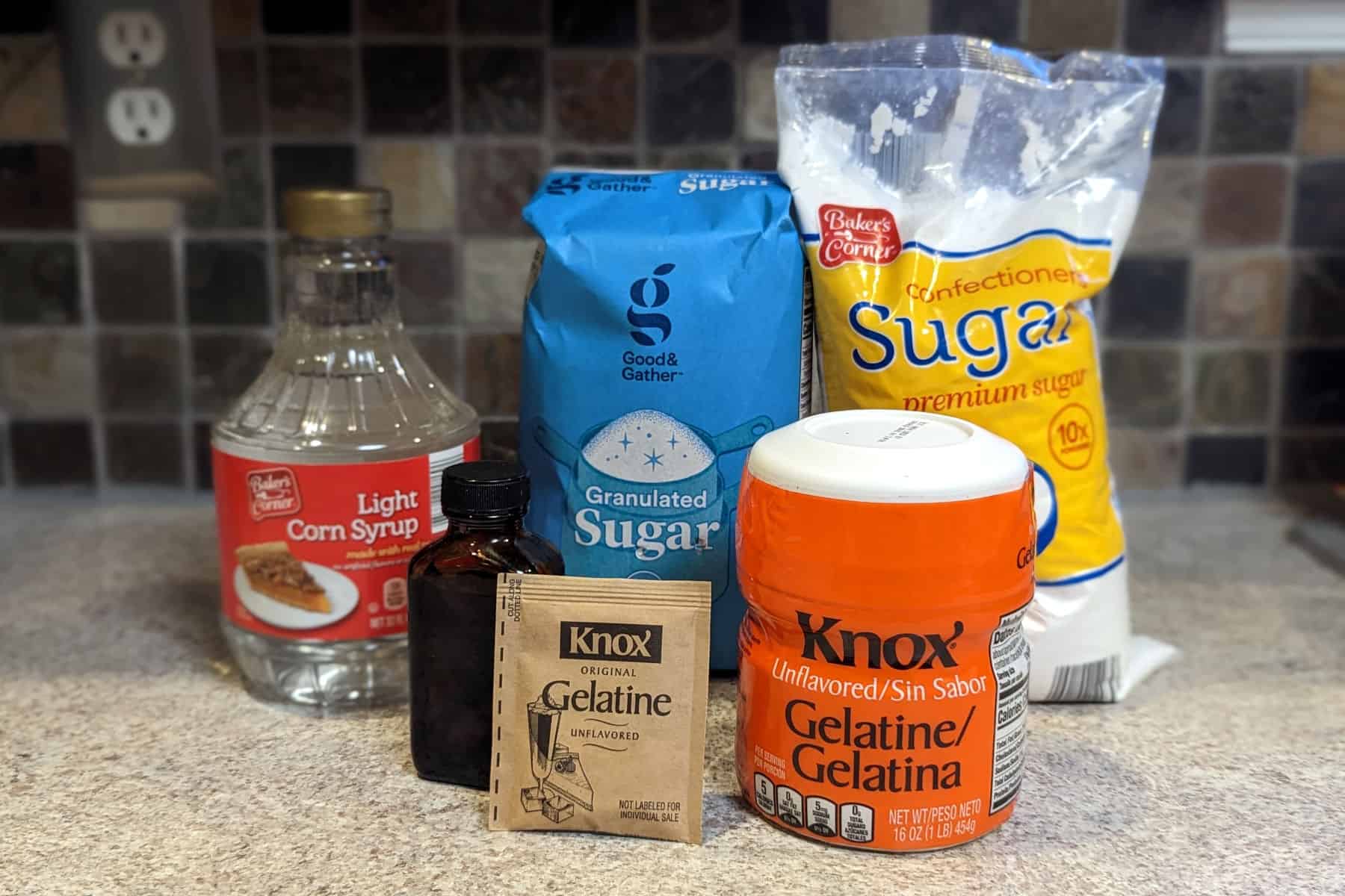 ingredients for marshmallows - corn syrup, sugar, powdered sugar, vanilla, and gelatin