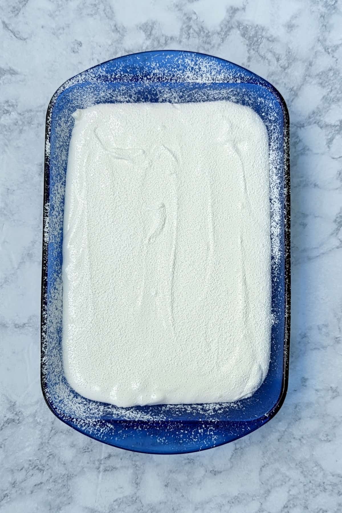 marshmallow poured and flattened into a pan coated with powdered sugar