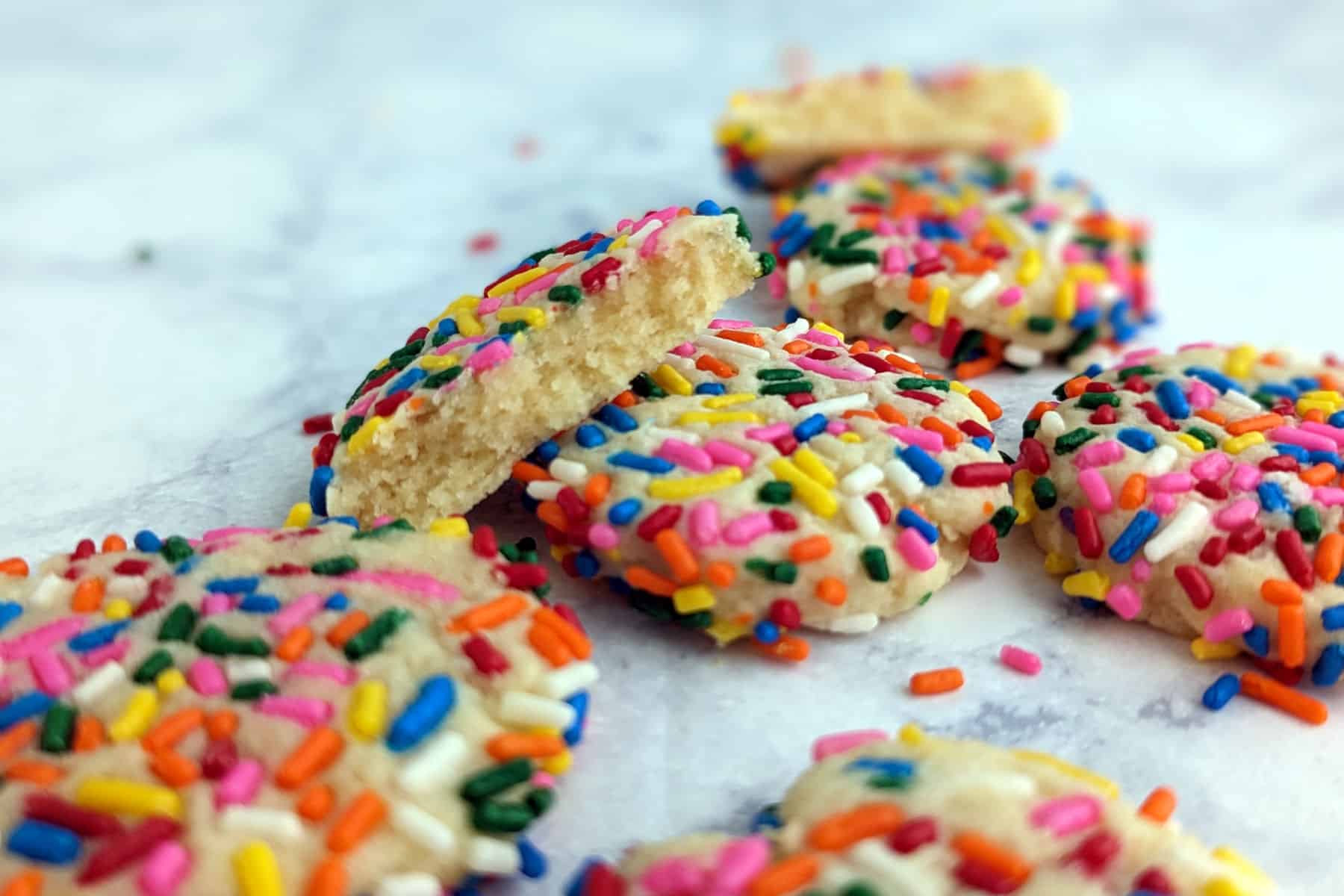 cookies on a counter, with one broken open