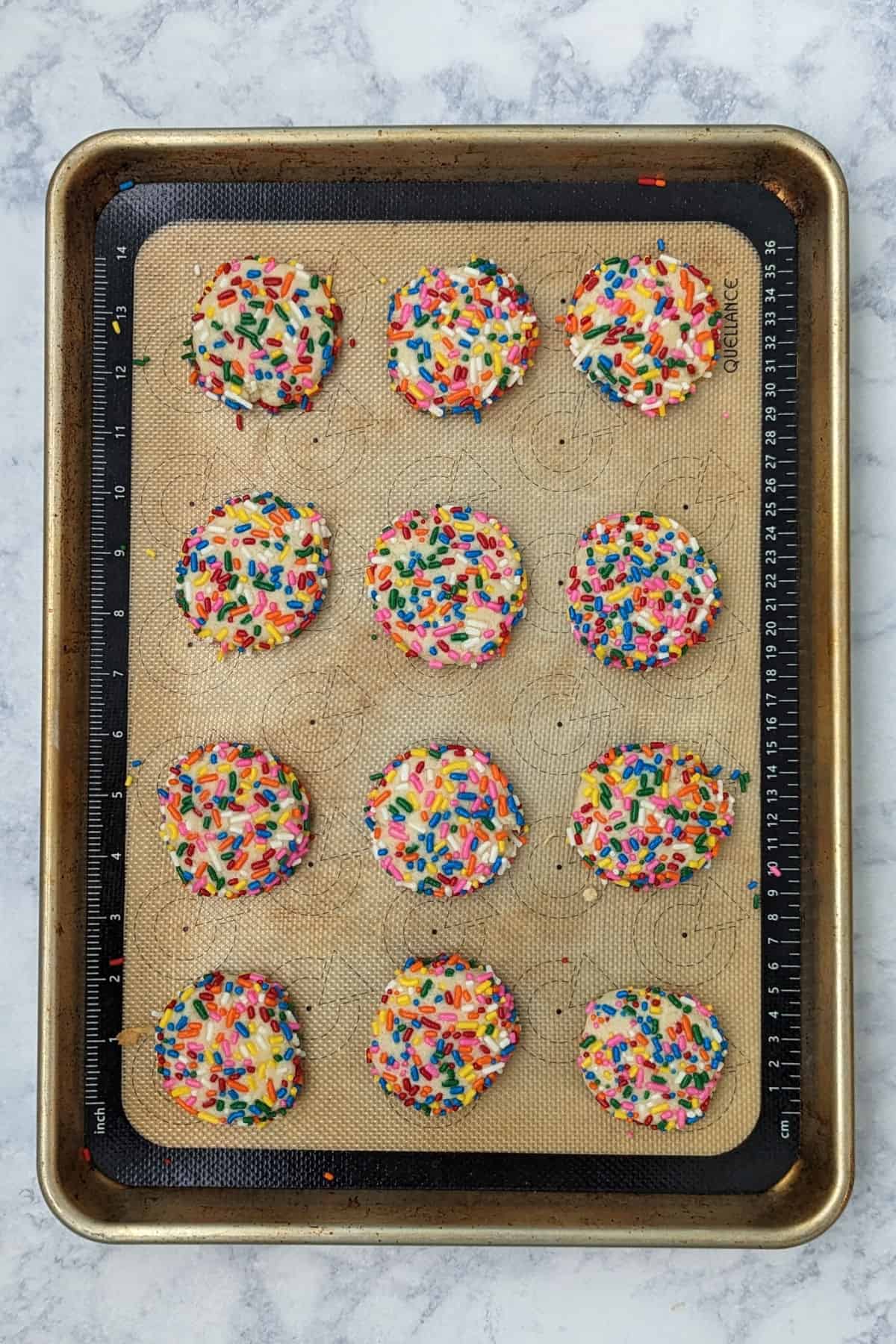 sprinkle cookies, after baking, on a baking sheet