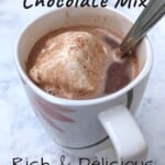 mug with hot chocolate with marshmallow and spoon