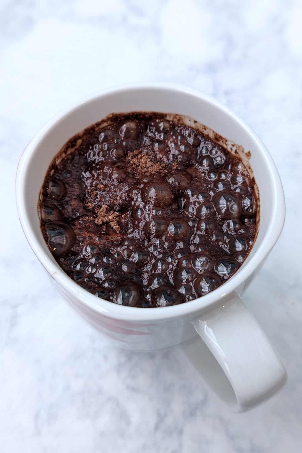 hot chocolate that has bubbled up on top