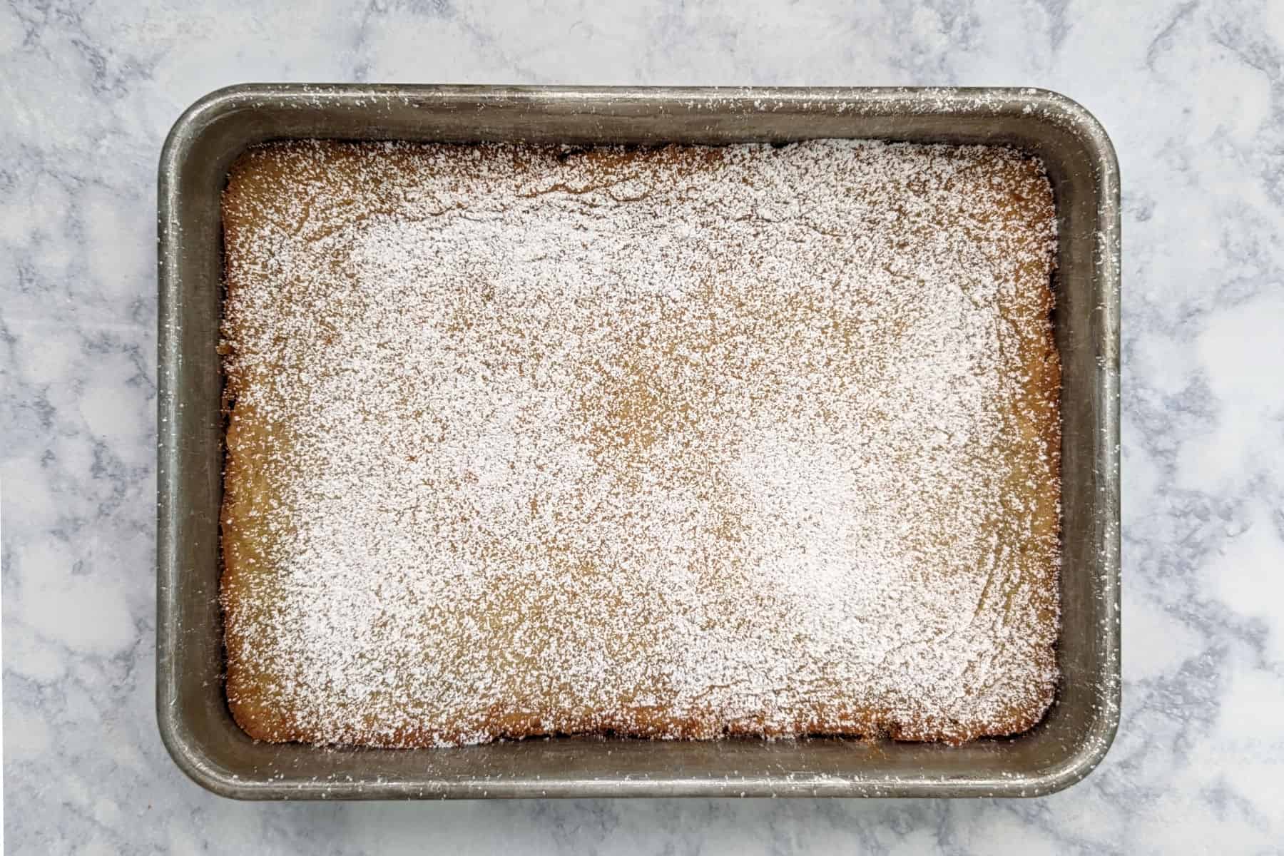 gooey butter cake, dusted with powdered sugar
