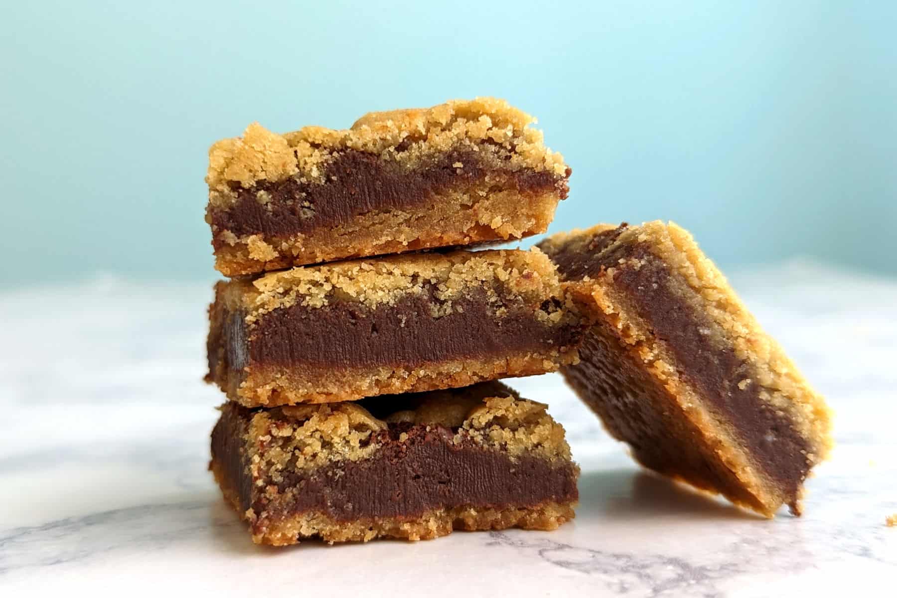 a stack of fudgy butterscotch bars, with one on its side