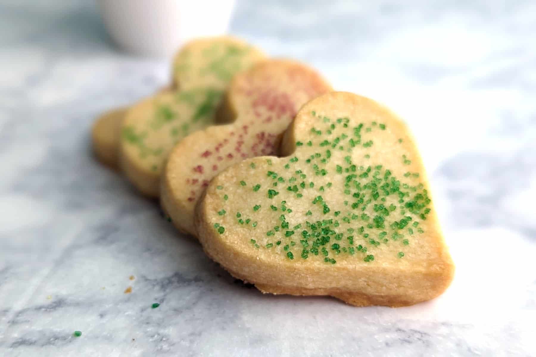 shortbread cookie hearts spread out in a pile