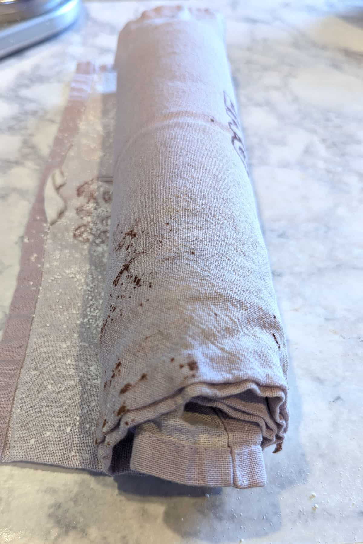 chocolate cake rolled in a tea towel