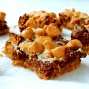 A cookie bar with chocolate and butterscotch chips, up close to see texture.