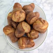 A platter of popovers, viewed from directly overhead.