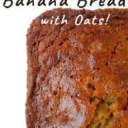 A close-up of banana bread's top and edge crust. Text overlay for Pinterest reads "Classic Banana Bread with Oats! A No-Mixer Recipe!"