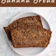 Two slices of banana bread, stacked and staggered, on a plate. Text overlay for Pinterest reads "Classic Banana Bread With Oats!"