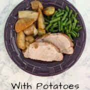 Slices of fennel-crusted pork, with green beans and roasted potatoes, pears, and onions, on a plate. Text overlay for Pinterest reads "Fennel Pork Loin with Potatoes and Pears."