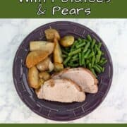Slices of fennel-crusted pork, with green beans and roasted potatoes, pears, and onions, on a plate. Text overlay for Pinterest reads "Fennel Pork Loin with Potatoes and Pears. Easy and Delicious!"