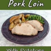 Slices of fennel-crusted pork, with green beans and roasted potatoes, pears, and onions, on a plate. Text overlay for Pinterest reads "Fennel Pork Loin with Potatoes and Pears."