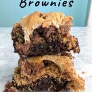 Two s'mores brownies, stacked on top of each other. Text overlay for Pinterest reads "S'mores Brownies. Gooey & Sweet!"