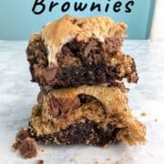 Two s'mores brownies, stacked on top of each other. Text overlay for Pinterest reads "S'mores Brownies. Gooey & Sweet!"