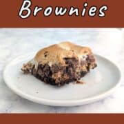 A s'mores brownie, on a plate. Text overlay for Pinterest reads "S'mores Brownies. Gooey & Sweet!"