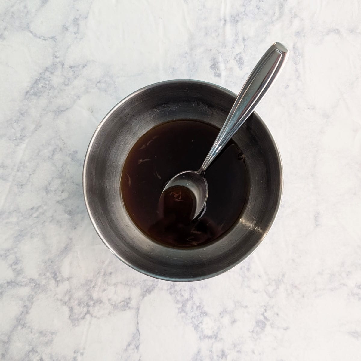 Soy-based dressing in a small bowl.