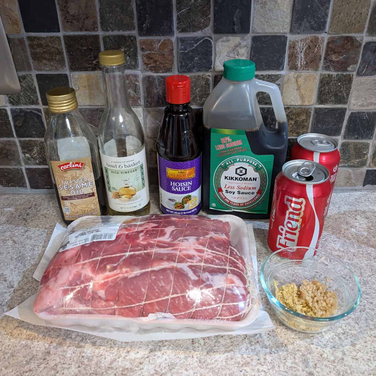 Pork shoulder, ginger, garlic, sesame oil, rice vinegar, hoisin sauce, less sodium soy sauce, and Coca-Cola.