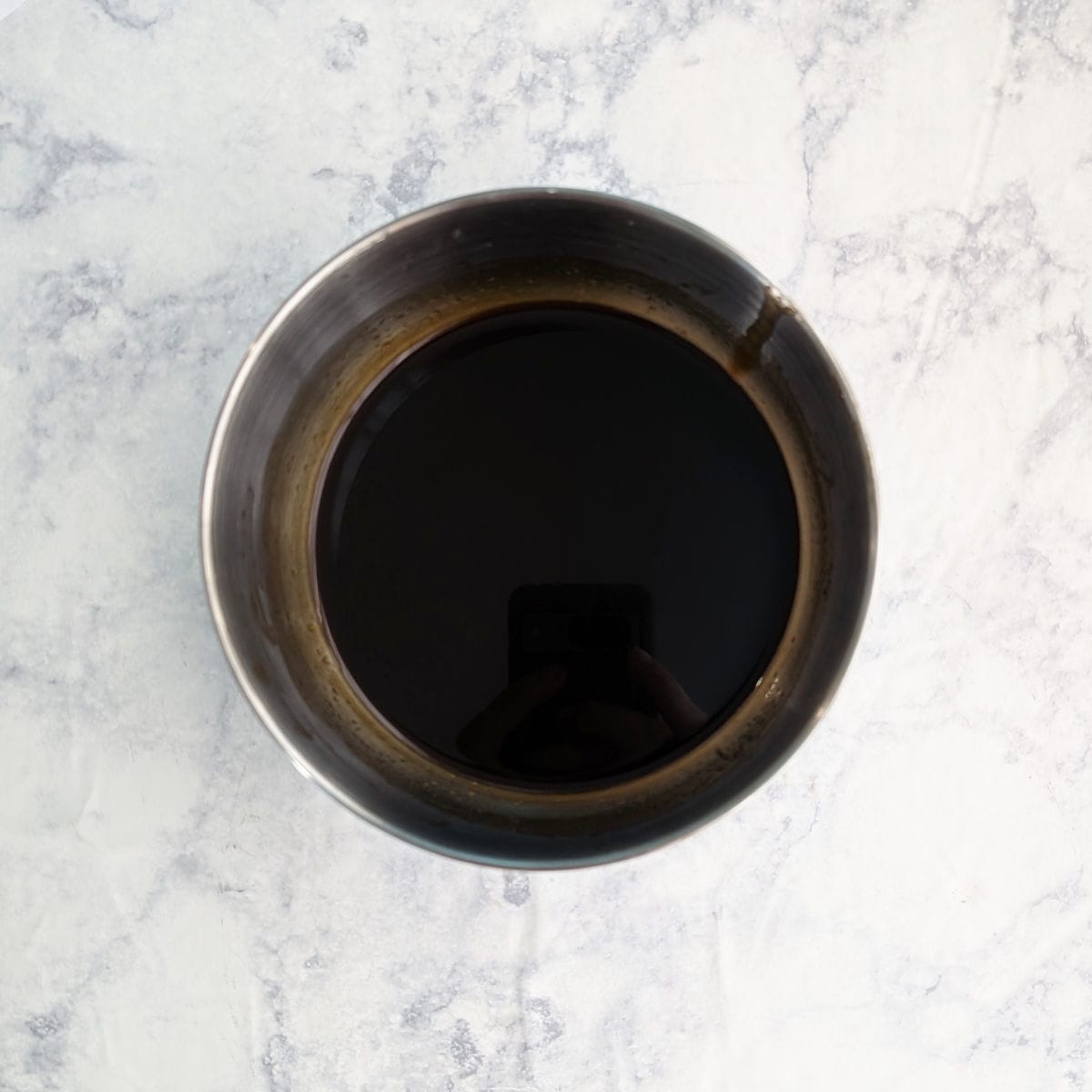 Sauce in a metal bowl.
