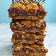 A stack of 4 chocolate oat bars. Text overlay for Pinterest reads "Chocolate Oat Bars. Rich and Decadent!"