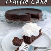 A bite of chocolate truffle cake on a fork, next to a slice of cake with whipped cream. The remaining cake is on a plate in the background.