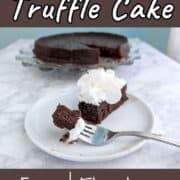 A bite of chocolate truffle cake on a fork, next to a slice of cake with whipped cream. The remaining cake is on a plate in the background.