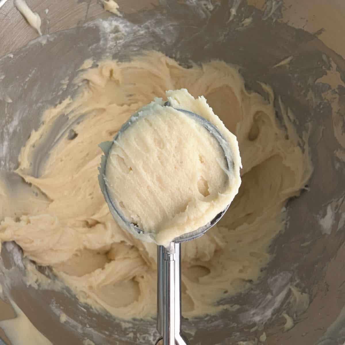 Gooey butter cookie dough, in a medium cookie scoop.