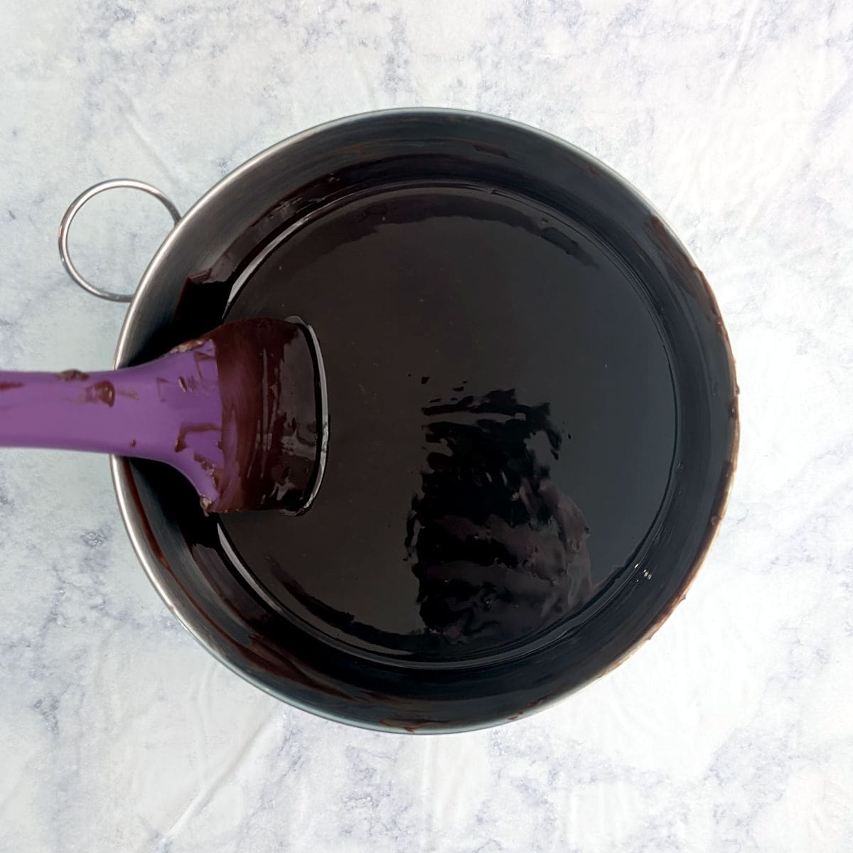 Melted chocolate and butter in a mixing bowl.