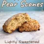 An apple and pear scone, split open to show texture. Text overlay reads "Apple & Pear Scones. Lightly Sweetened. No Cinnamon! Easy As Cookies."