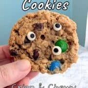 The top of a monster cookie, with 3 candy eyeballs attached.