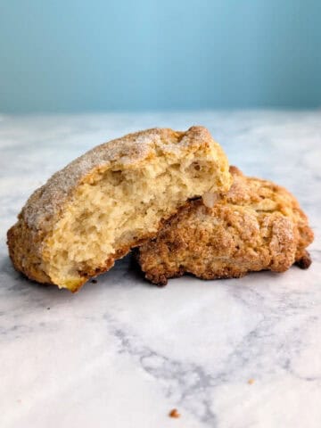 An apple and pear scone, split open to show texture.