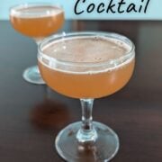 Whiskey sherry cocktail, in two couple glasses. Text overlay for Pinterest reads "Whiskey Sherry Cocktrail. Cozy. Nutty. Slightly Sweet. Easy As Cookies."