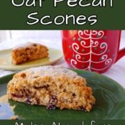 A Cranberry Oat Pecan Scone on a green plate. Another scone is on lighter green plate next to a red mug. Text overlay for Pinterest reads "Cranberry Oat Pecan Scones. Make Ahead for Christmas Morning. Easy As Cookies."