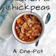 A bowl of Stewed Chicken and Chickpeas, with a spoon and a napkin. Text overlay for Pinterest reads "Stewed Chicken and Chickpeas. A One-Pot Weeknight Dinner! Easy As Cookies."