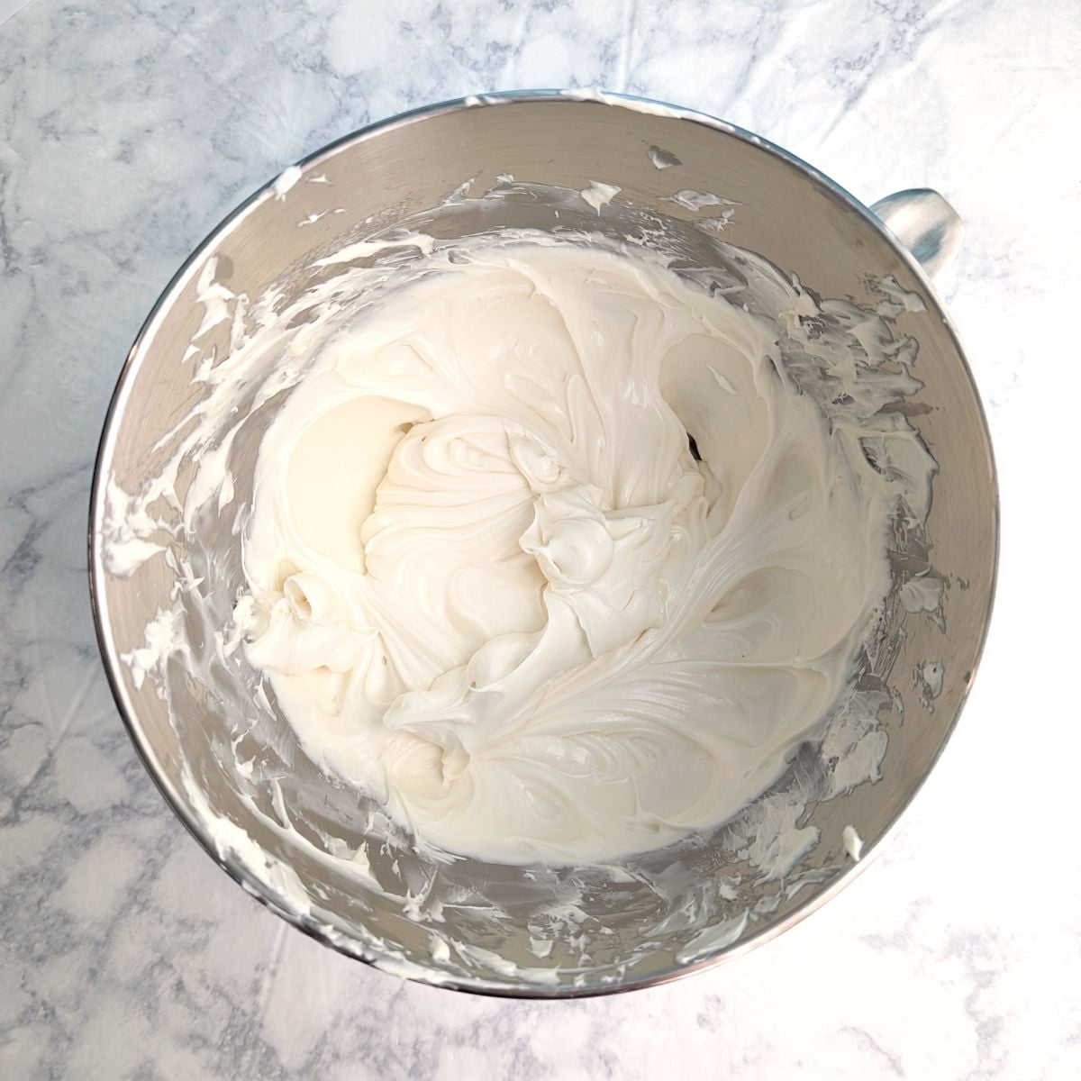 Beaten cream cheese, vanilla, and sugar, in a stand mixer bowl.