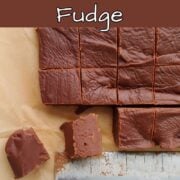 Homemade chocolate fudge, cut into squares. One square is on its side to show texture. Text overlay for Pinterest reads "Easy Homemade Chocolate Fudge. Rich & Creamy. No Thermometer, Perfect for Gifting. Easy As Cookies."