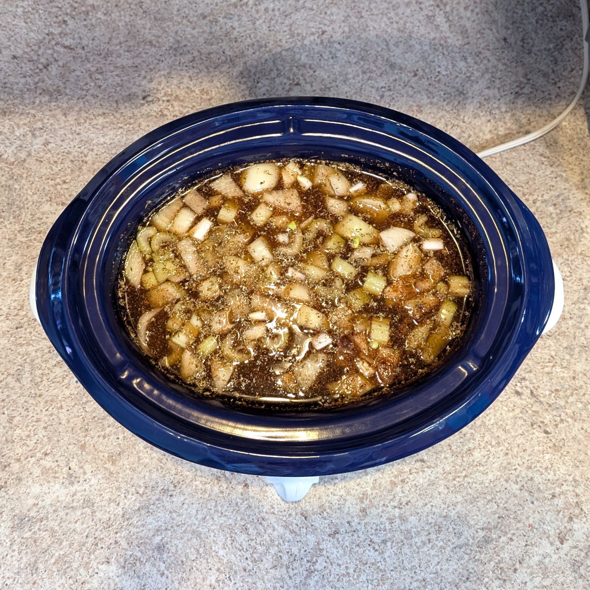 Ingredients for Southwestern Bean and Barley Soup, in a 4-quart slow cooker before cooking.