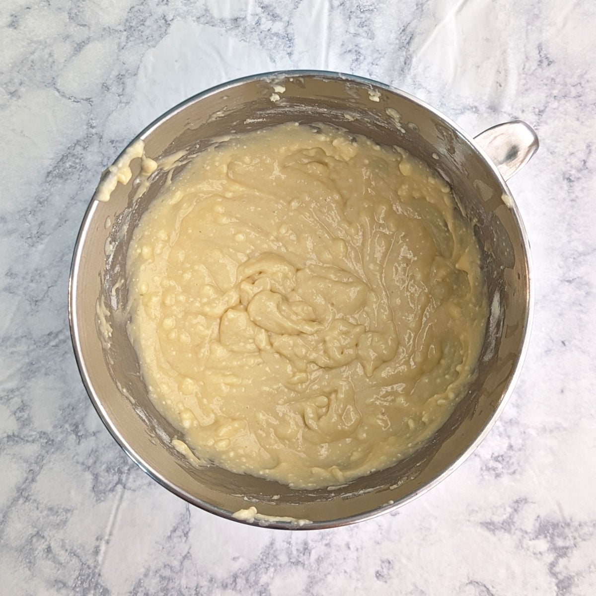 Batter for ricotta pound cake, in a stand mixer bowl.
