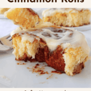 A cinnamon roll with a bite of it on a fork. Text overlay reads "Overnight Cinnamon Rolls. Soft, Homemade, Ready for Brunch."