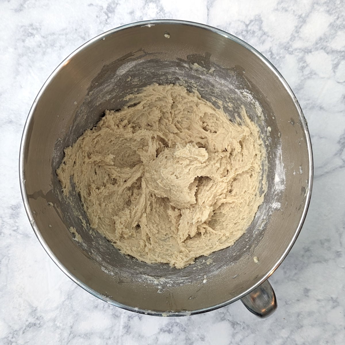 Yeasted cake base for gooey butter cake, in a bowl before kneading.