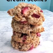 A stack of strawberry and cream scones. Text overlay reads "Strawberry and Cream Scones. Fresh Strawberry Brunch Scones. Easy As Cookies."